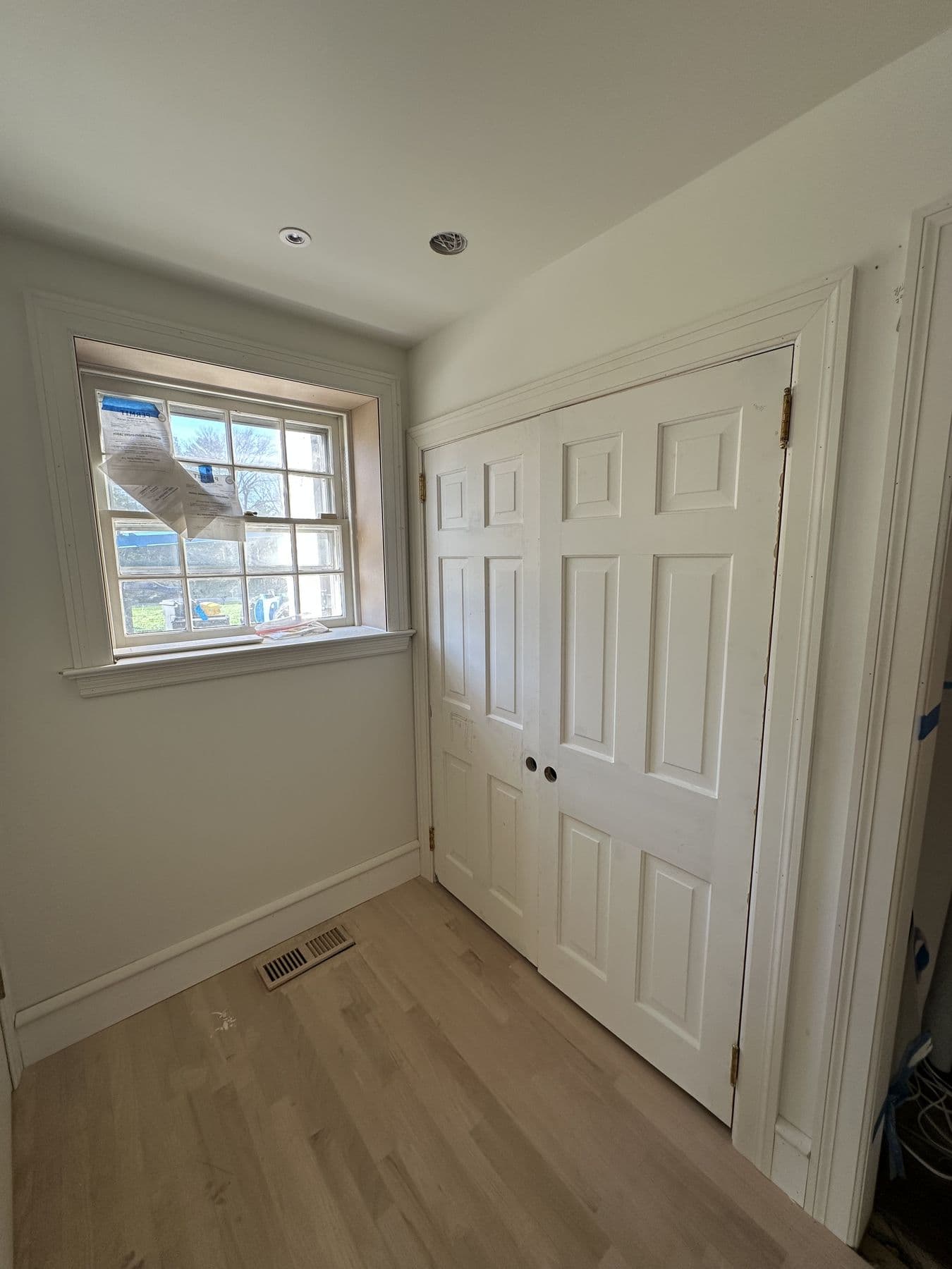 Bedroom with new double closet doors and window trim