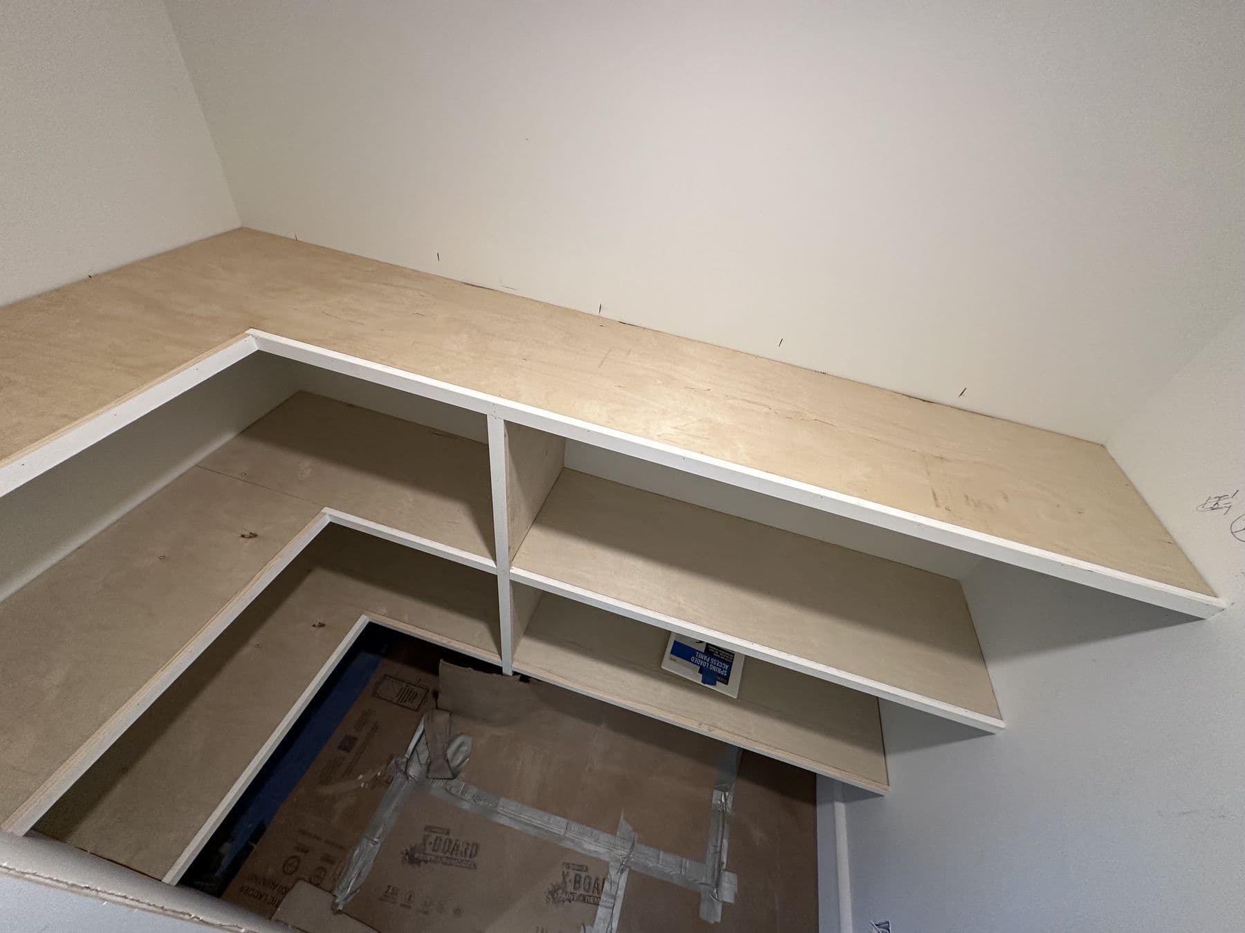 Corner of the built-in closet shelving with solid wood tops