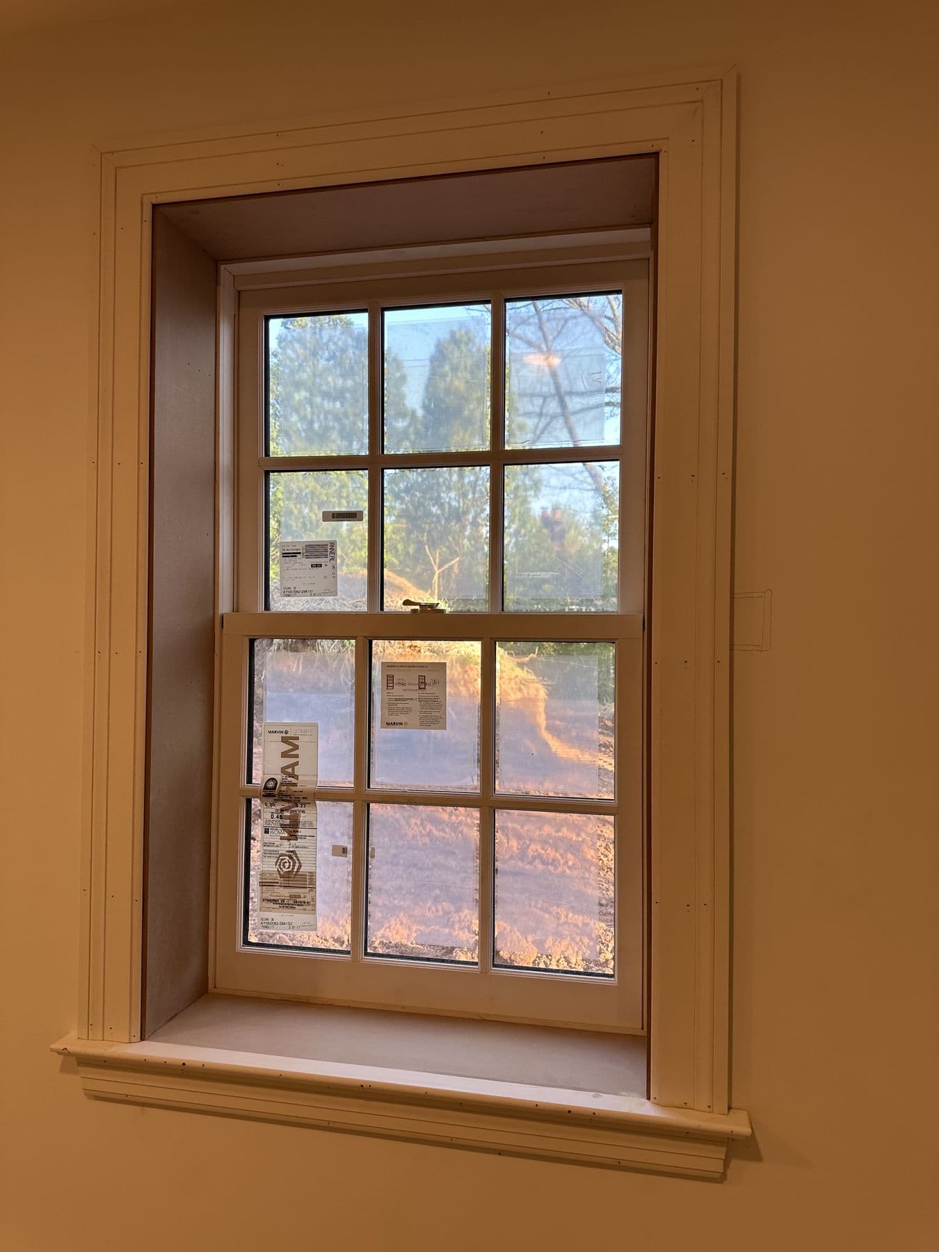 Window with new casing in a warm painted room